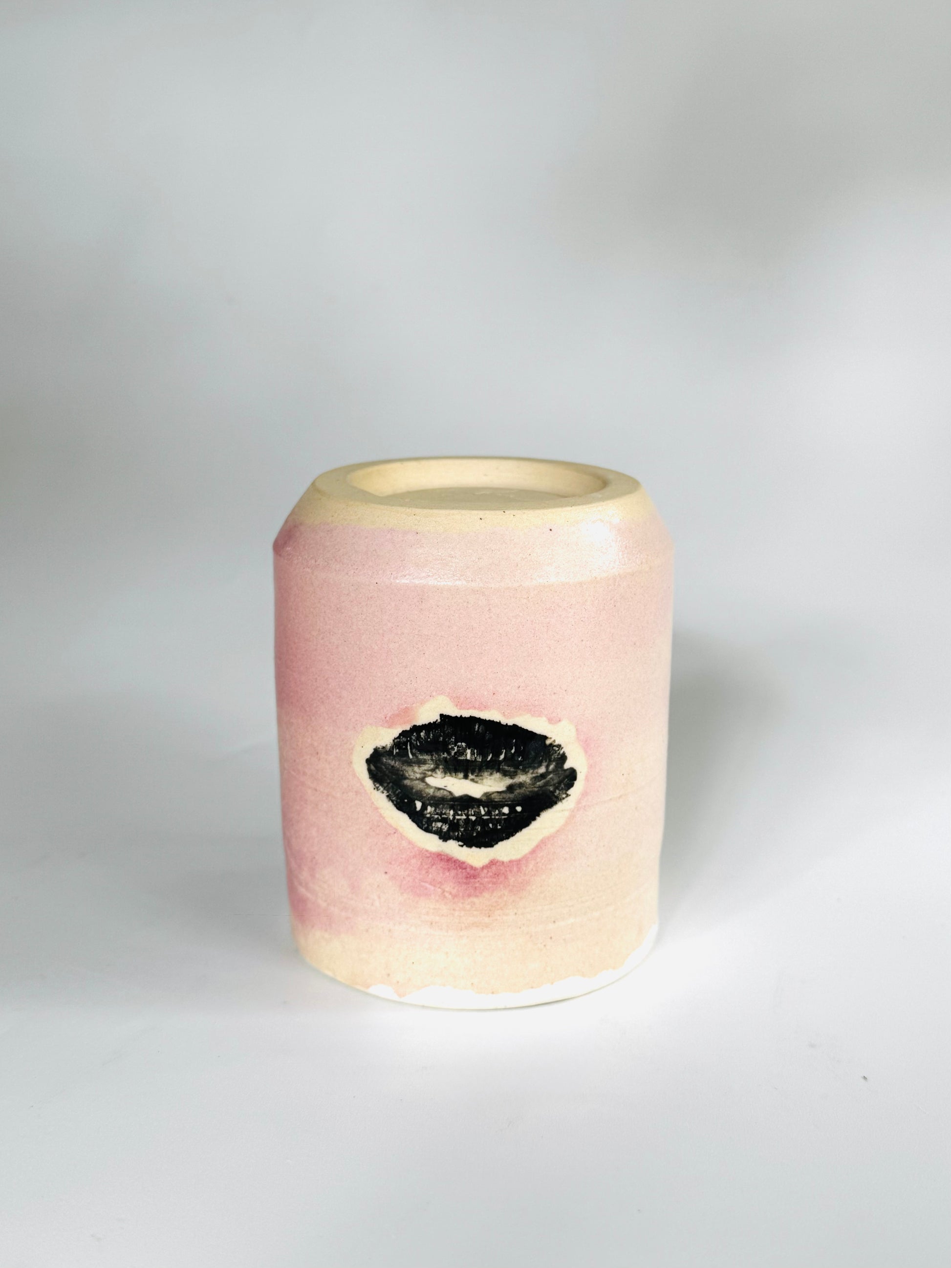 Flipped over view of the Large Kissy Cup Tumbler by Rita Strayer Ceramics of Savannah. Cascading flux rim, various sea foam interior and celadon bloom shads. Stoneware, microwavable.