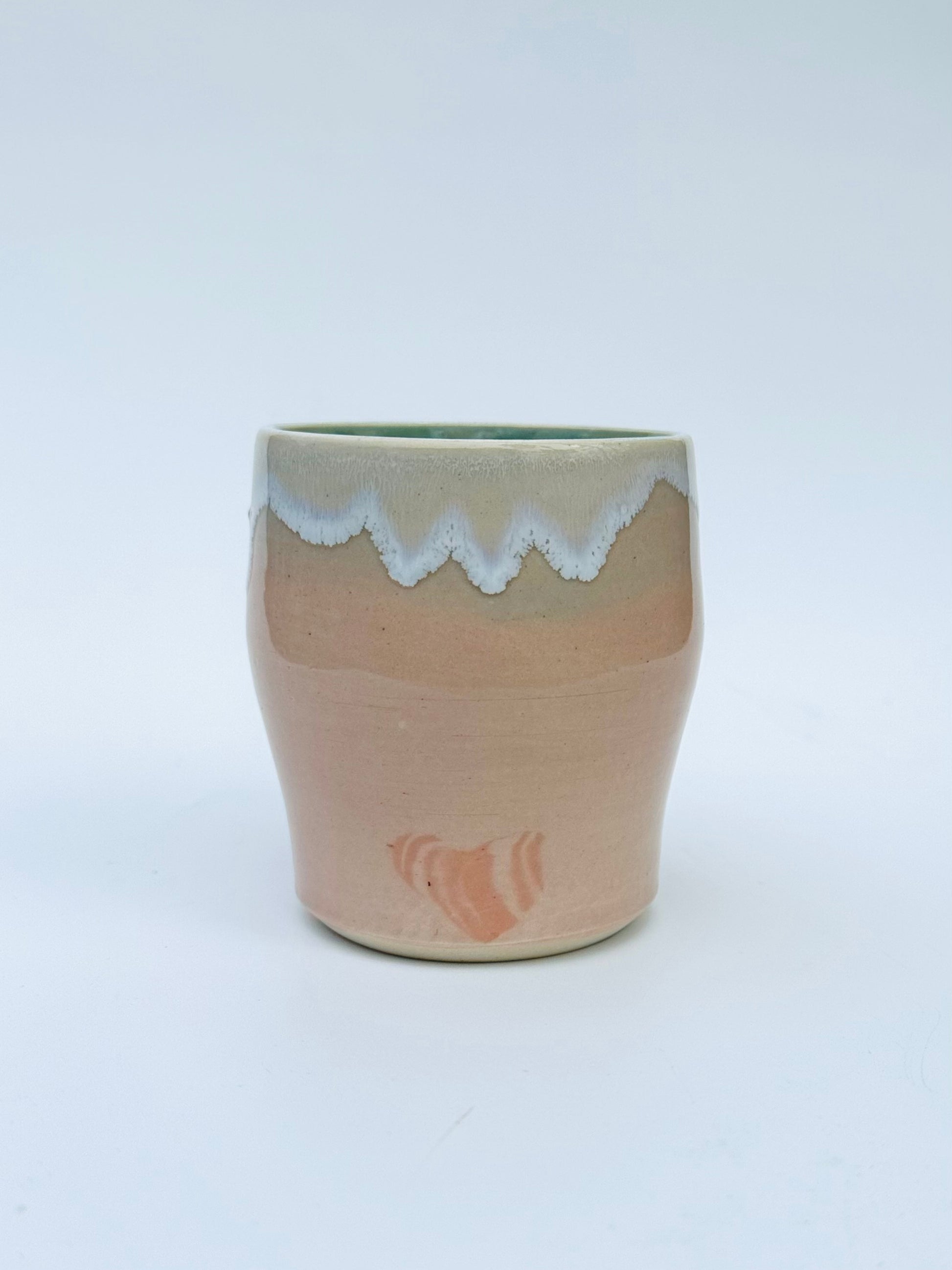 Head on view of the rare Nerikome Heart Tumbler from Rita Strayer Ceramics of Savannah. Subtle heart motif. Suitable cup for milk, nightstand water, wine, whiskey & juice. Various colors in this design.