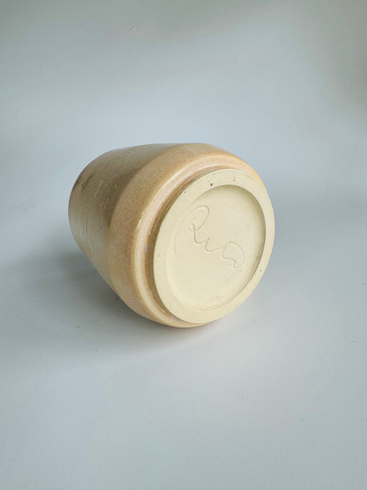 Juice n’ Booze Cup 8oz - only from Rita Strayer Ceramics of Savannah. Flipped on its side view of cup from the rear. A little cup for a little nip of wine, vermouth, whisk(e)y, or juice. Fridge and Room Temp beverages.