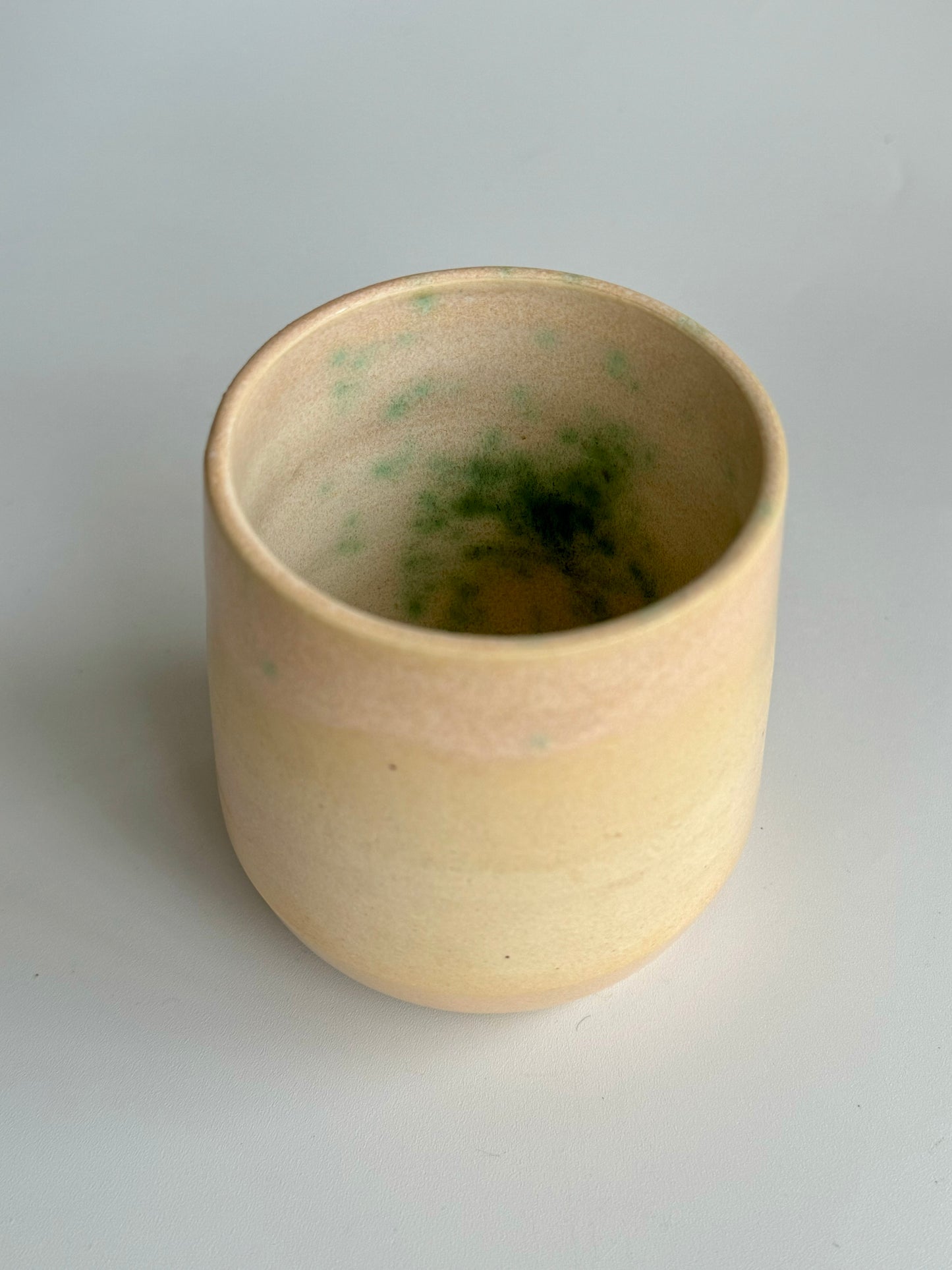 Juice n’ Booze Cup 8oz - only from Rita Strayer Ceramics of Savannah. Overhead with interior view. A little cup for a little nip of wine, vermouth, whisk(e)y, or juice. Fridge and Room Temp beverages.