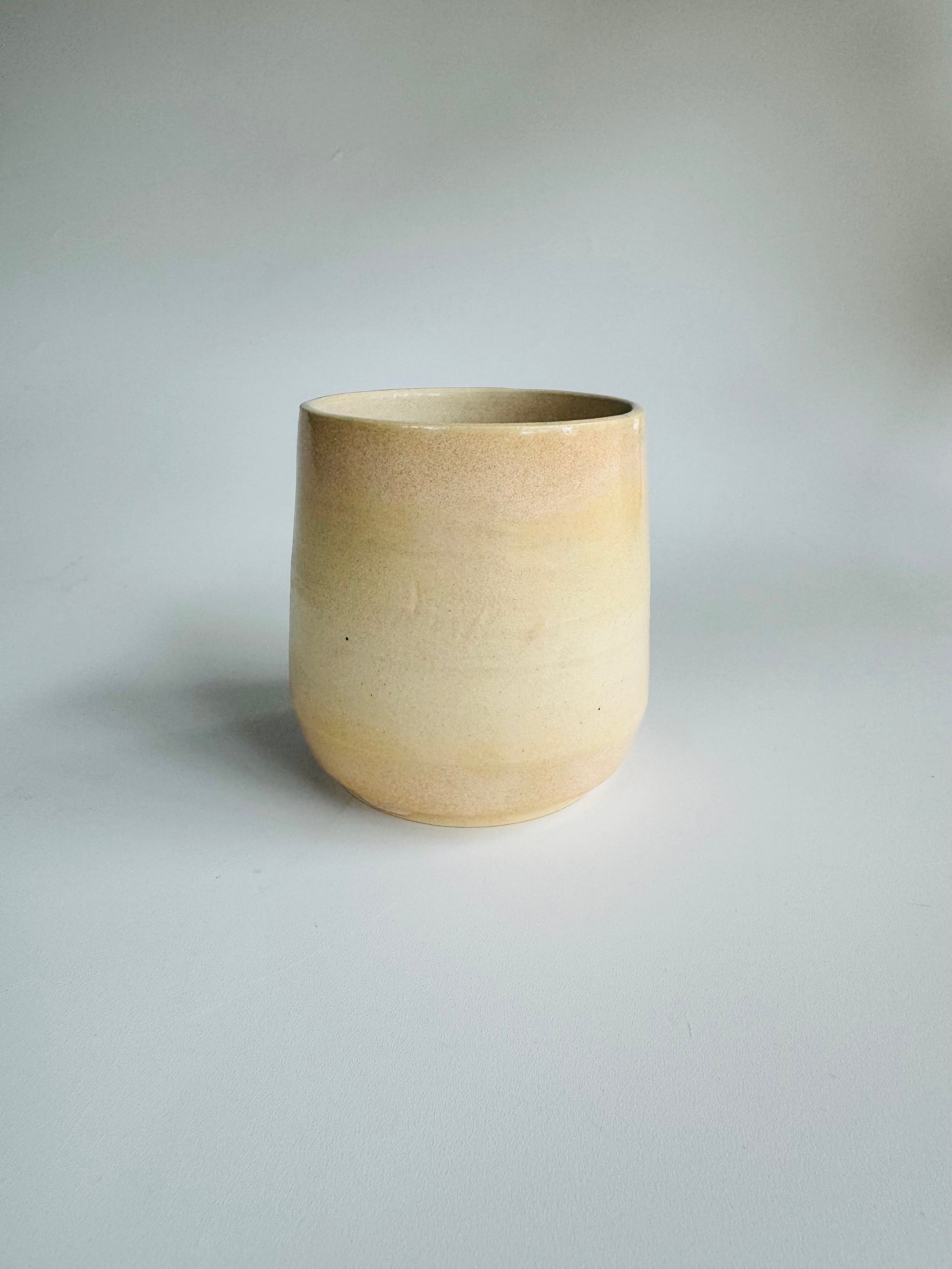 Juice n’ Booze Cup 8oz - only from Rita Strayer Ceramics of Savannah. Straight ahead view with very slight interior rim view. A little cup for a little nip of wine, vermouth, whisk(e)y, or juice. Fridge and Room Temp beverages.