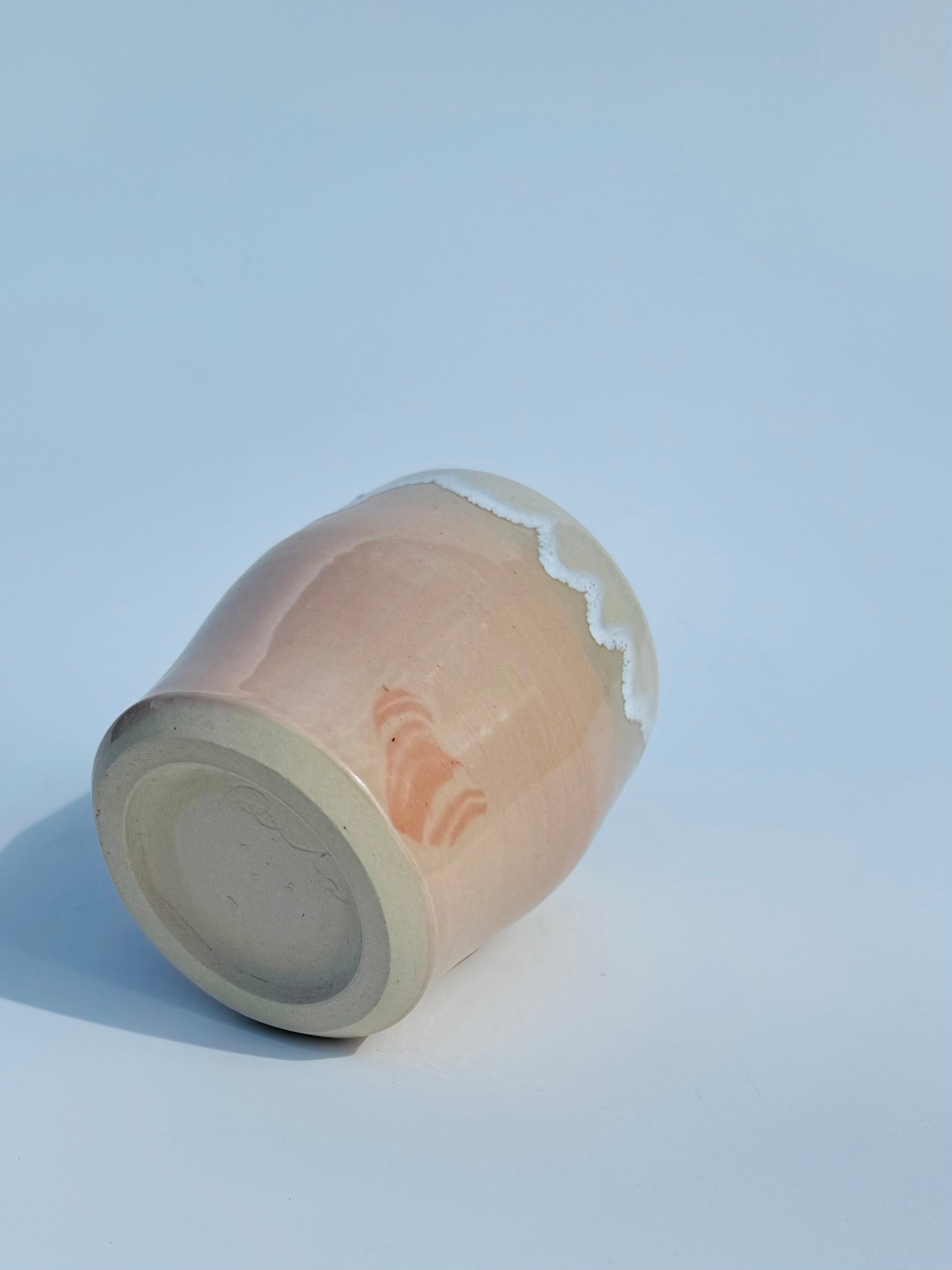 On its side bottom up view of the rare Nerikome Heart Tumbler from Rita Strayer Ceramics of Savannah. Subtle heart motif. Suitable cup for milk, nightstand water, wine, whiskey & juice. Various colors in this design.