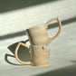 Teardrop Handle Mugs (pair) - only from Rita Strayer Ceramics of Savannah. Stacked view of the pair of mugs, with handles facing opposite directions.
