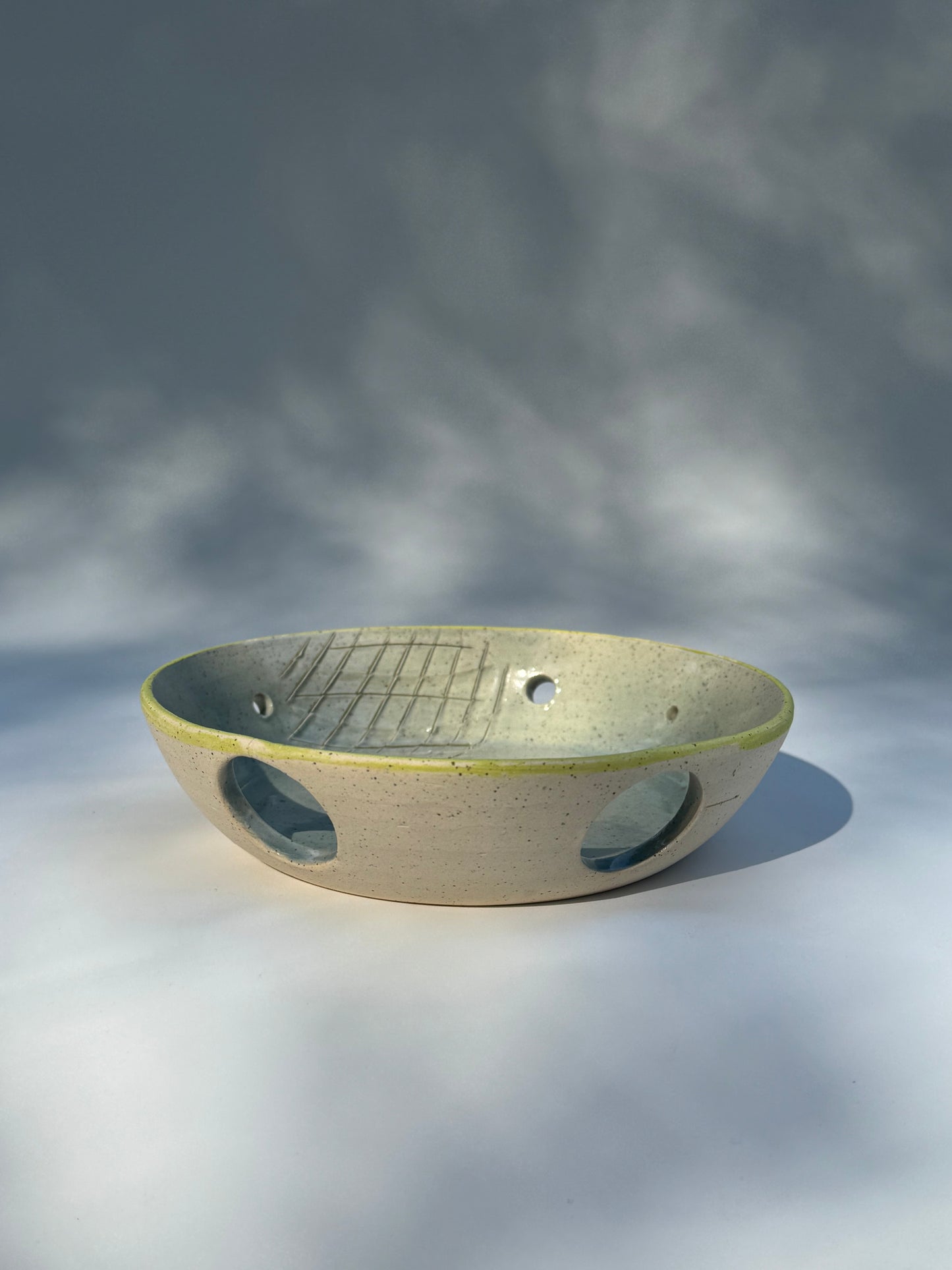 The classic chartreuse herb stripper with garlic grater by Rita Strayer Ceramic Savannah. Easily strip herb leaves. Two thumb holes for better handle. Stoneware clay.