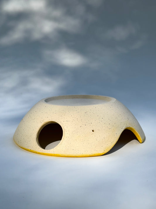 Upside down view of the classic yellow two thumb hole herb stripper with Garlic Grater by Rita Strayer Ceramics of Savannah. Easily strip leaves of your favorite herb. Stoneware clay.