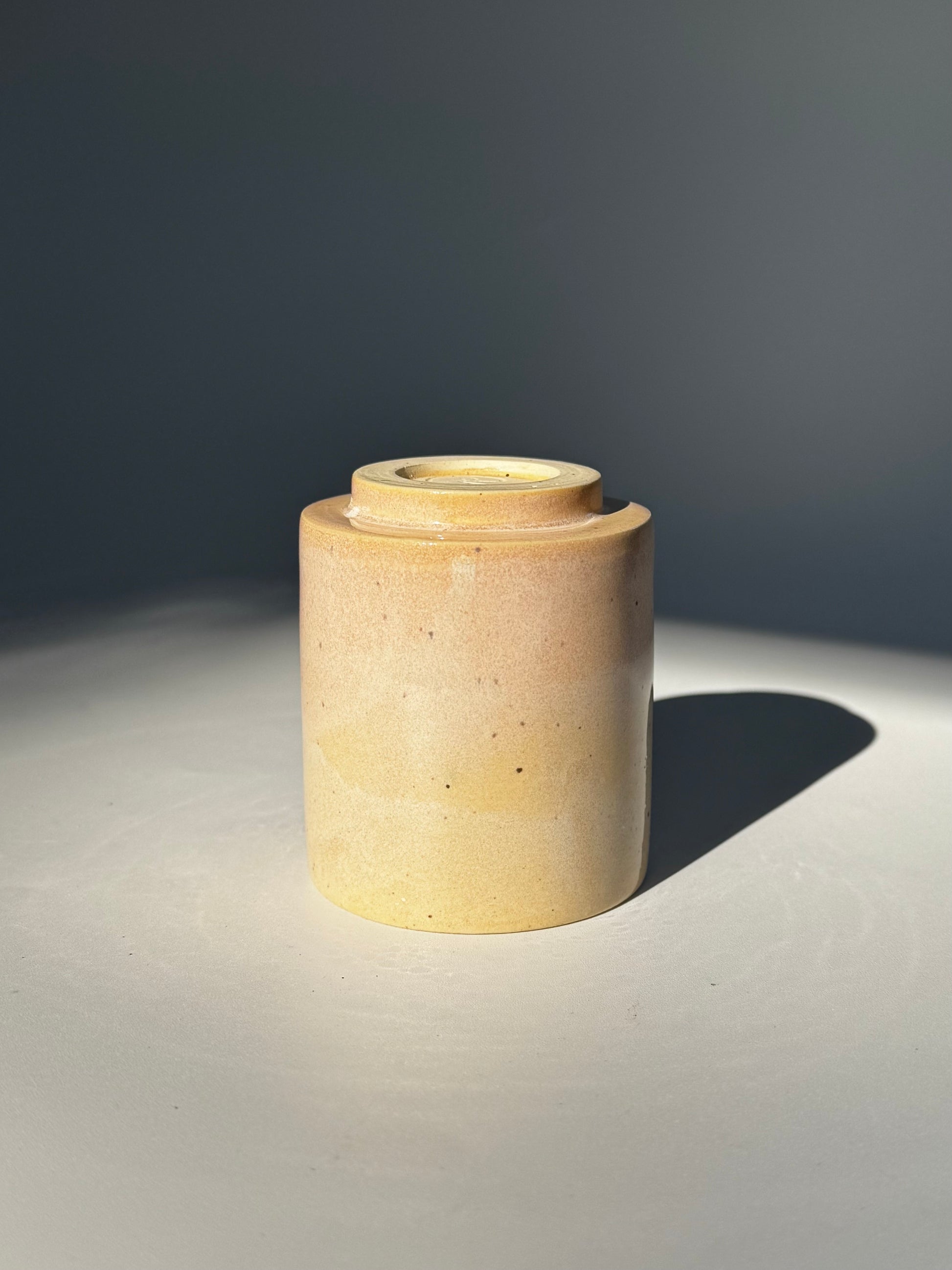 Upside down view of the unique Subtle Speckles Straight Cup by Rita Strayer Ceramics Savannah. A tasteful little 6oz tumbler. Very faint speckle pattern appears throughout the clay mix.